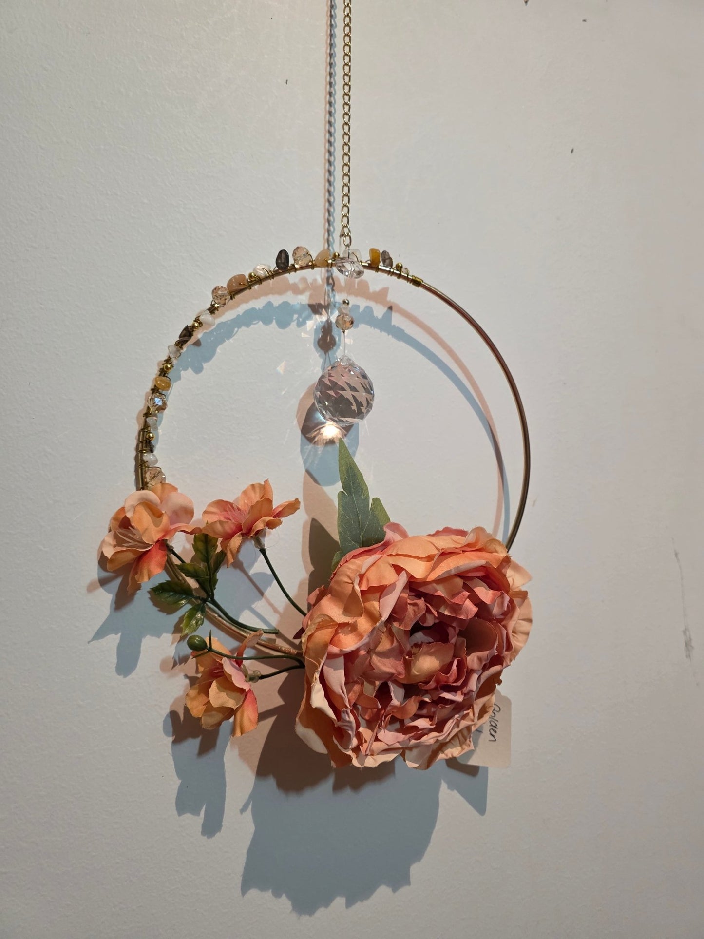 handmade crystal suncatcher in a gold hoop