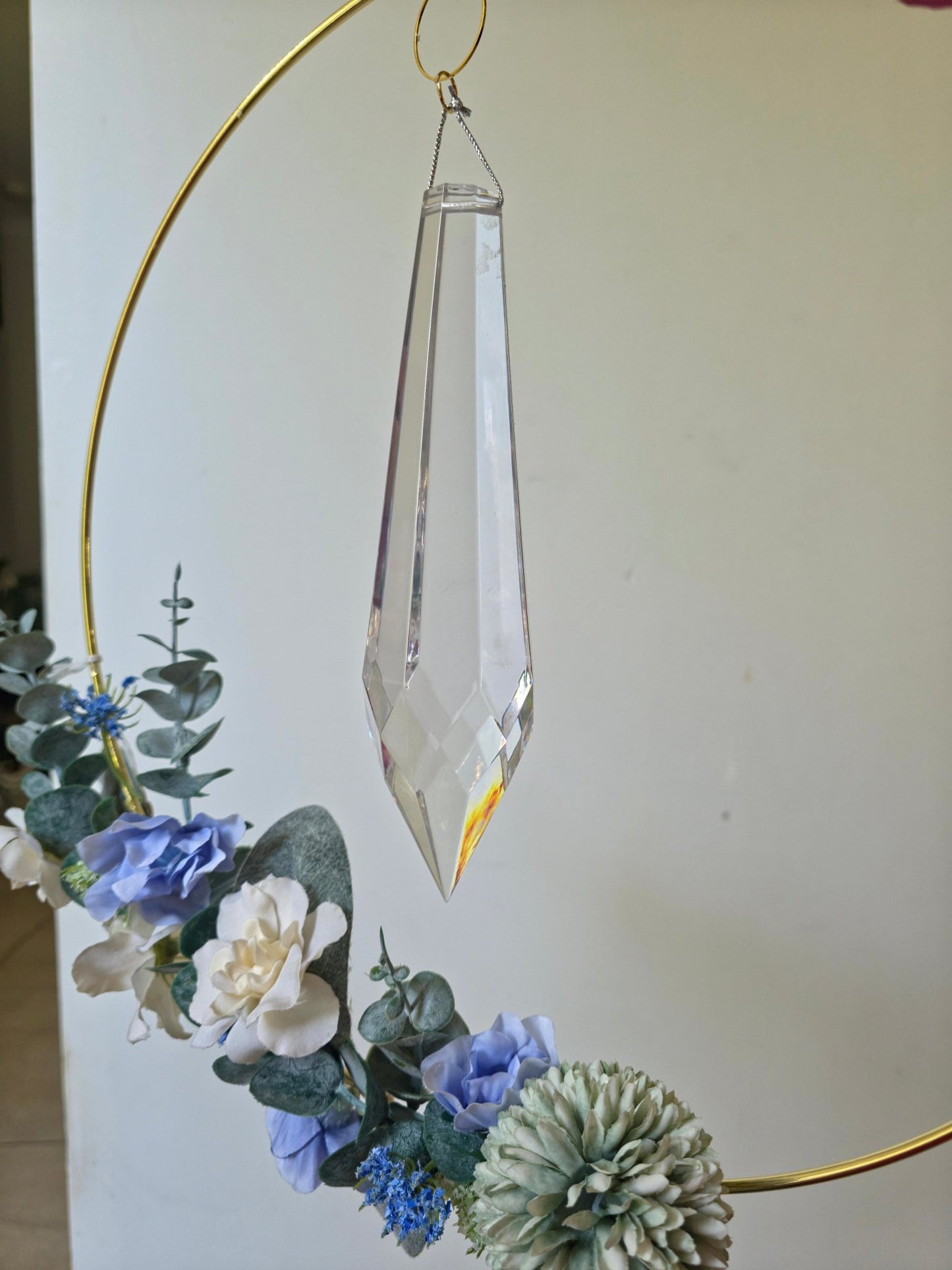 Close-up of Quiet Drift crystal prism and flowers
